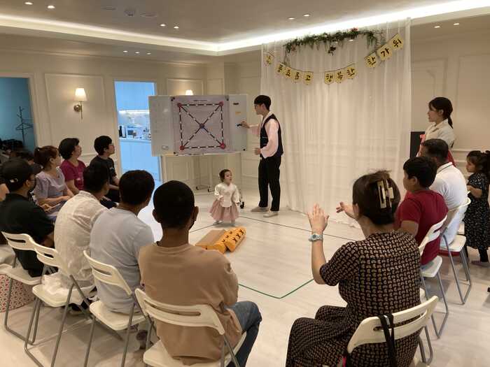 Families participating in a shared group activity