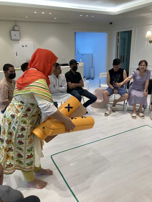 Community members learning first aid together