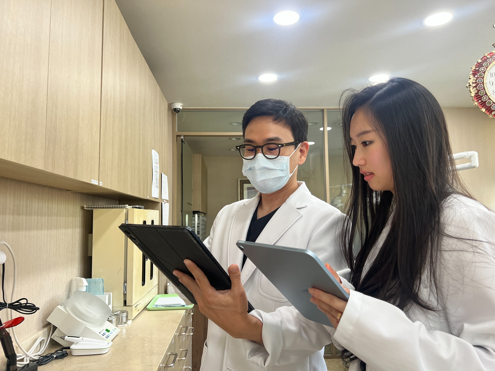 Grace reviewing clinical information with a physician