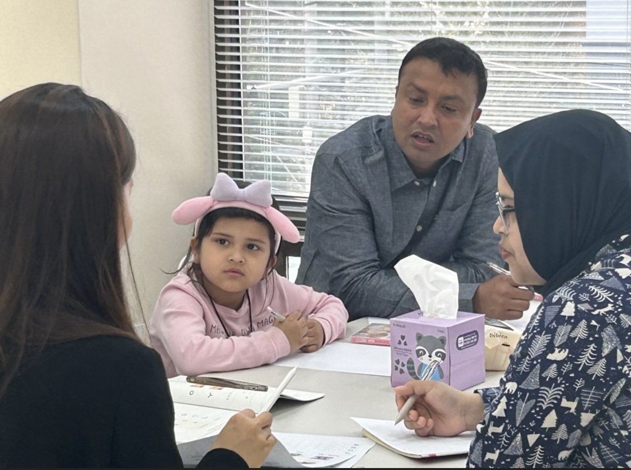 Listening to a multicultural family during a community meeting
