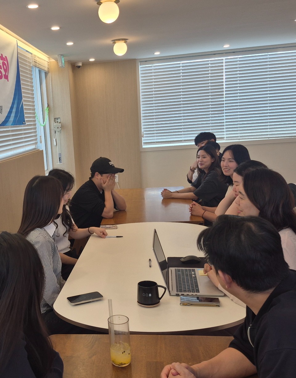 Community members meeting around a shared table