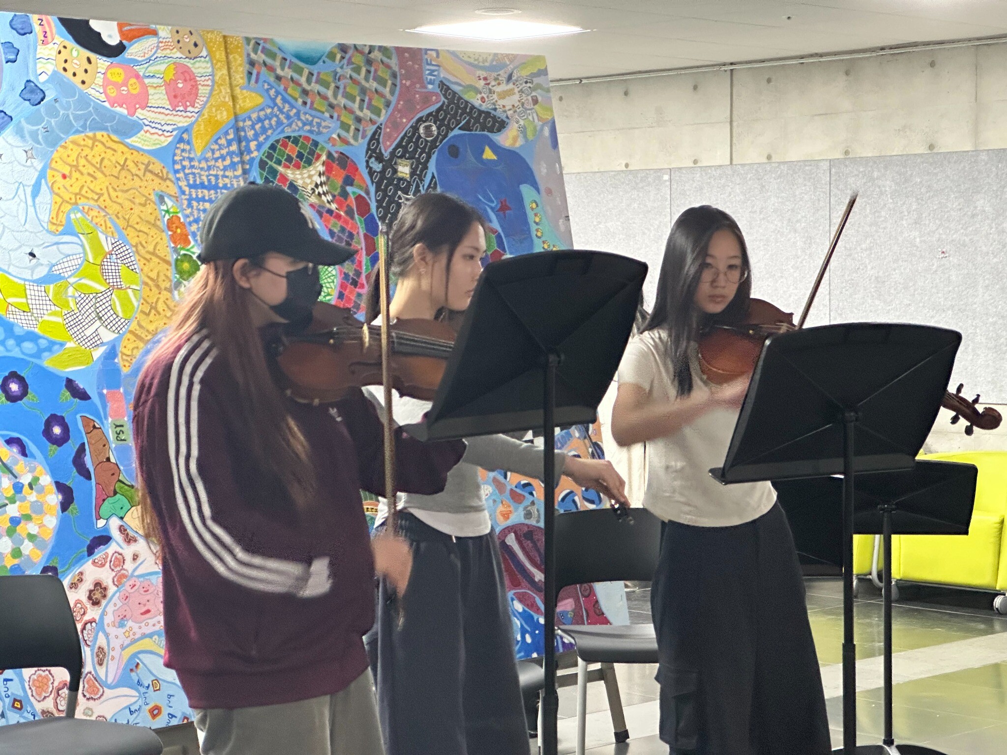 Three Crescendo musicians rehearsing together