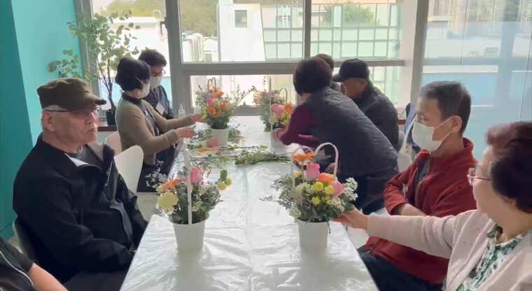 Participants meeting together around a shared activity