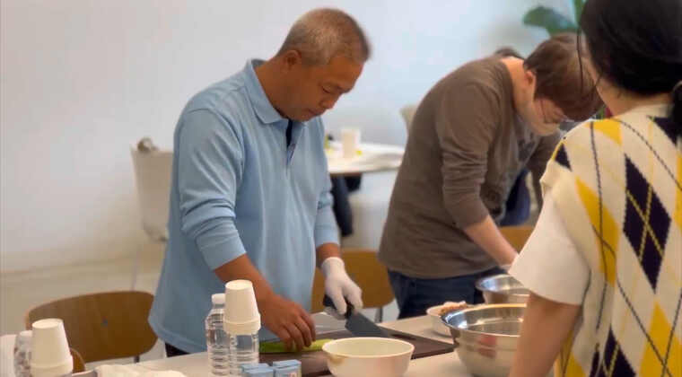Community members preparing food together