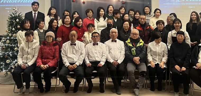 Choir members, volunteers, and supporters gathered after the concert