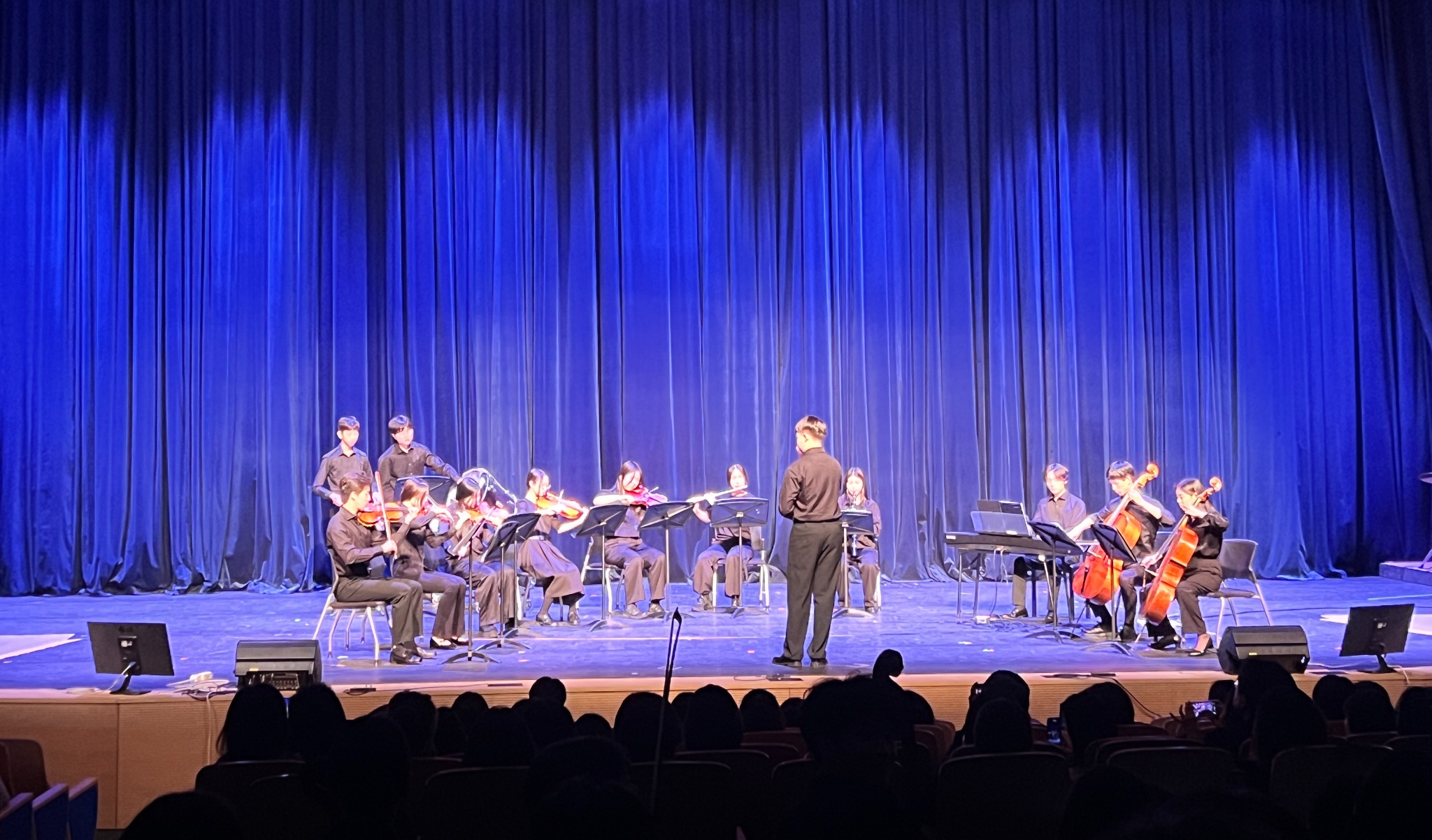 Student string ensemble performing on stage