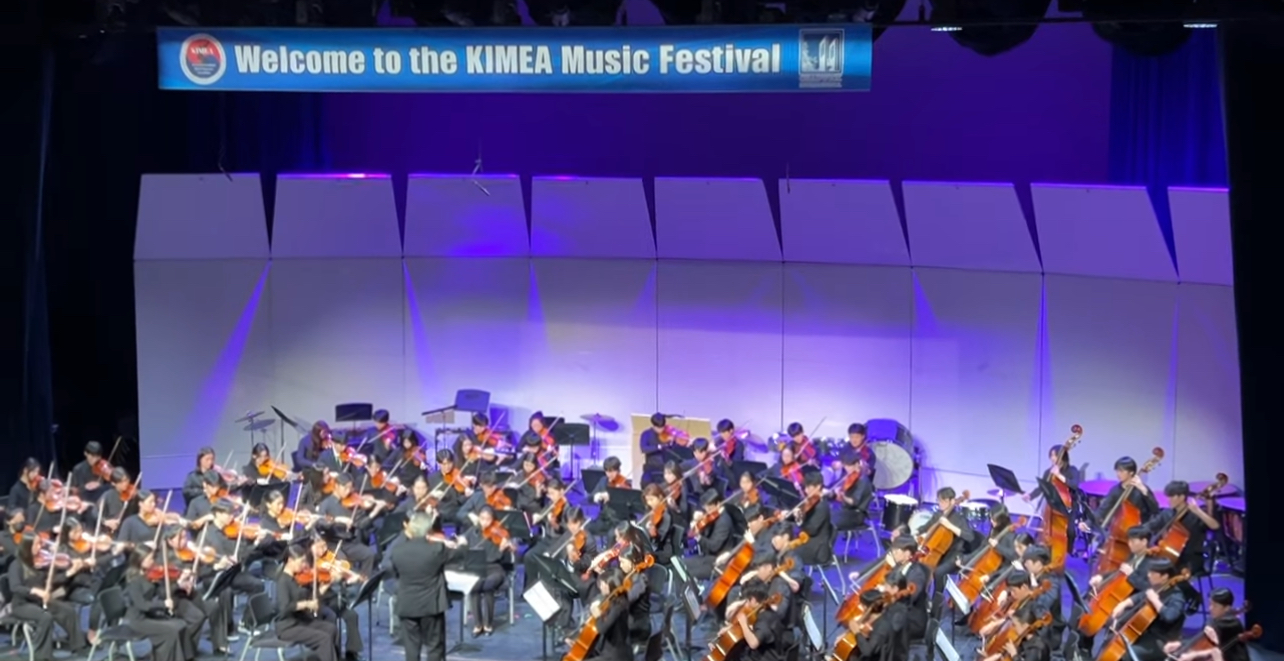 KIMEA Music Festival orchestra performing on stage
