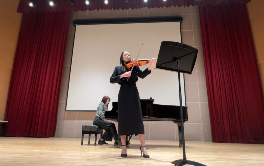 Grace performing viola at the KIMEA festival