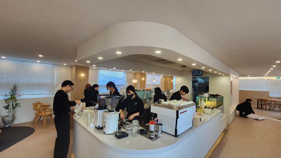 The team working together inside the completed café